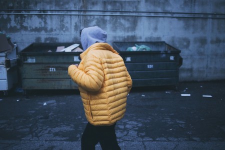 person and garbage bins.
