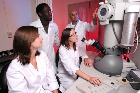 Cezar Khursigara in lab with students