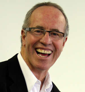 Barry Smit in a headshot against beige background