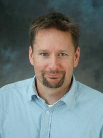 Dr. Andrew MacDougall poses for a portrait