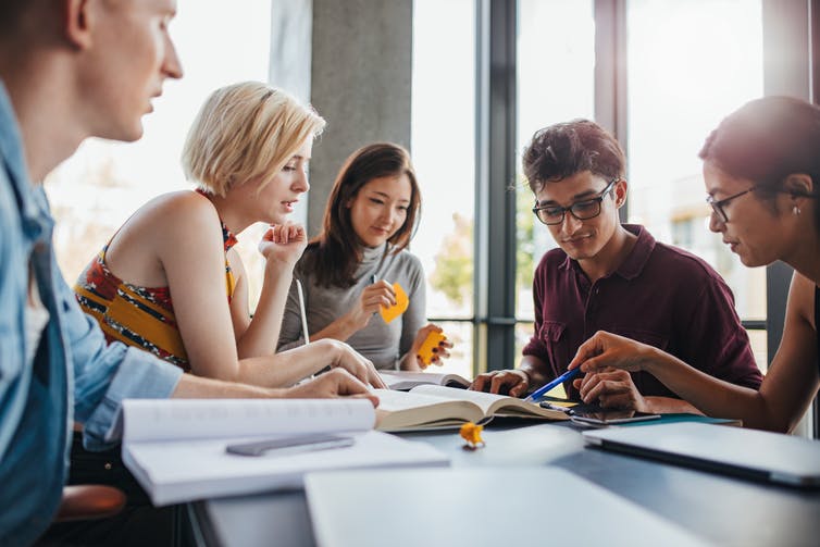 Students working together around a table