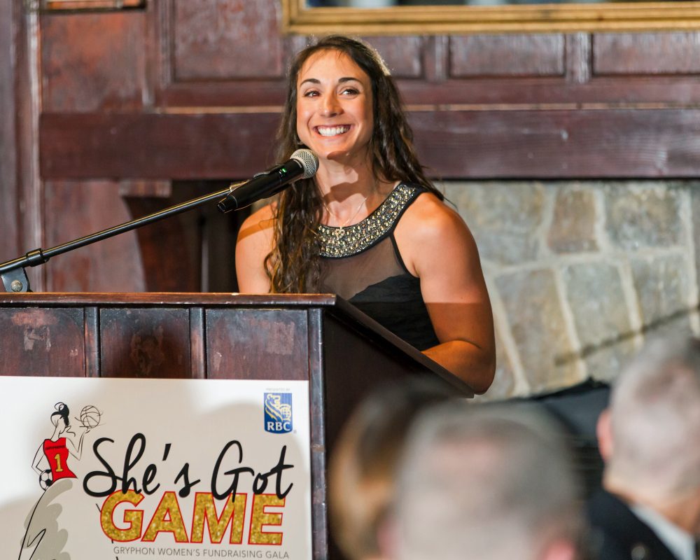 Athlete speaking at podium during She's Got Game gala