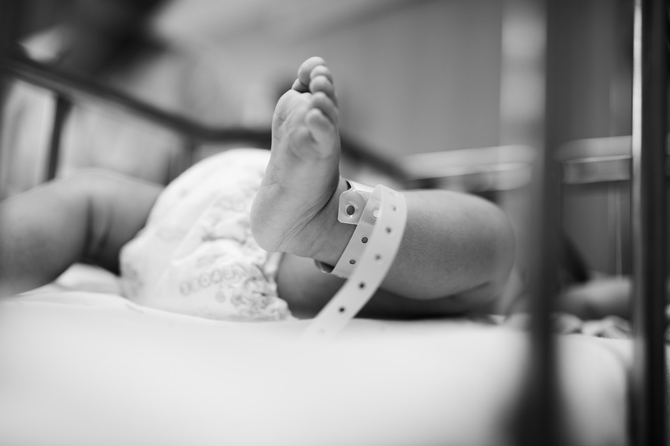 Close up shot of baby's feet in hospital setting