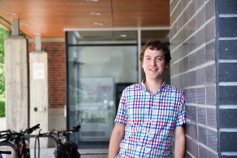 Prof. Graham Taylor leaning against a wall