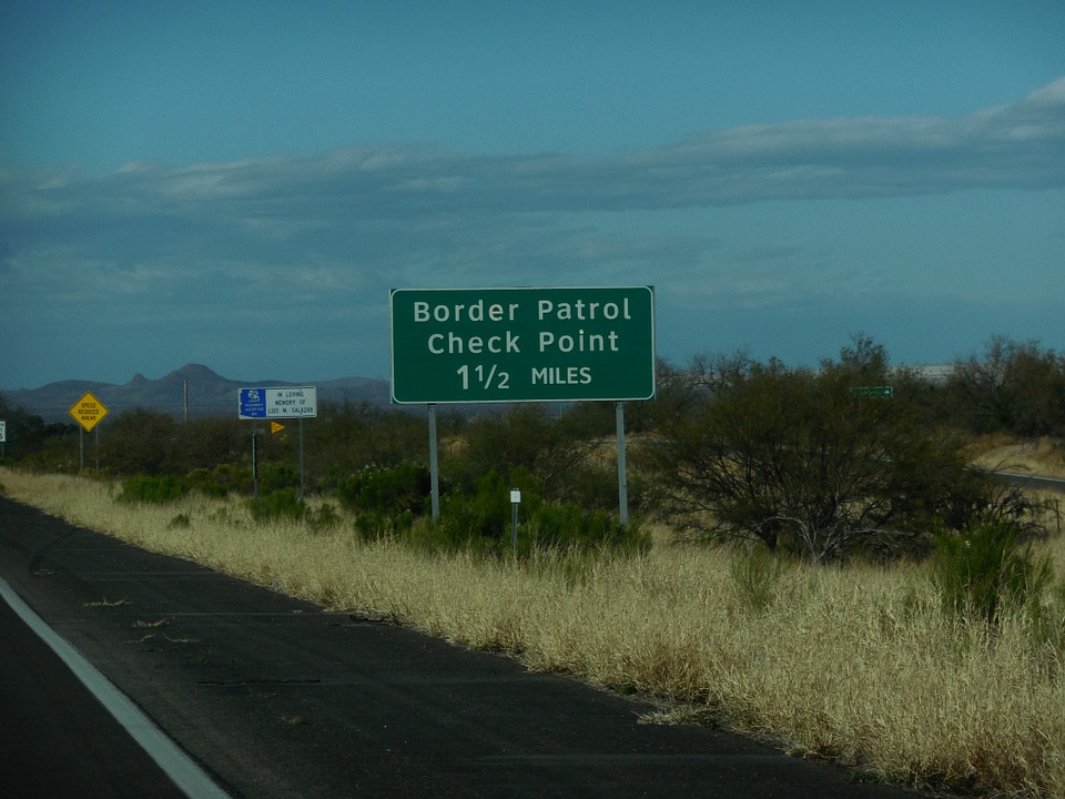 border patrol sign near border of US and Mexico