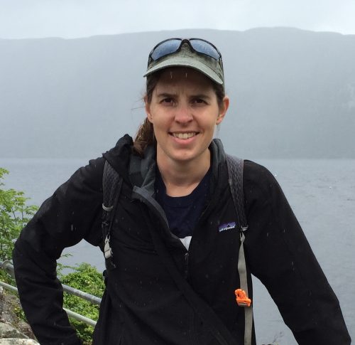 photo of Elizabeth Gow standing in front of water