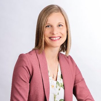 Dr. Katie Clow against a grey backdrop