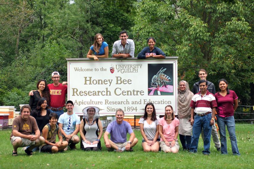 Honey Bee Research Centre team with sign