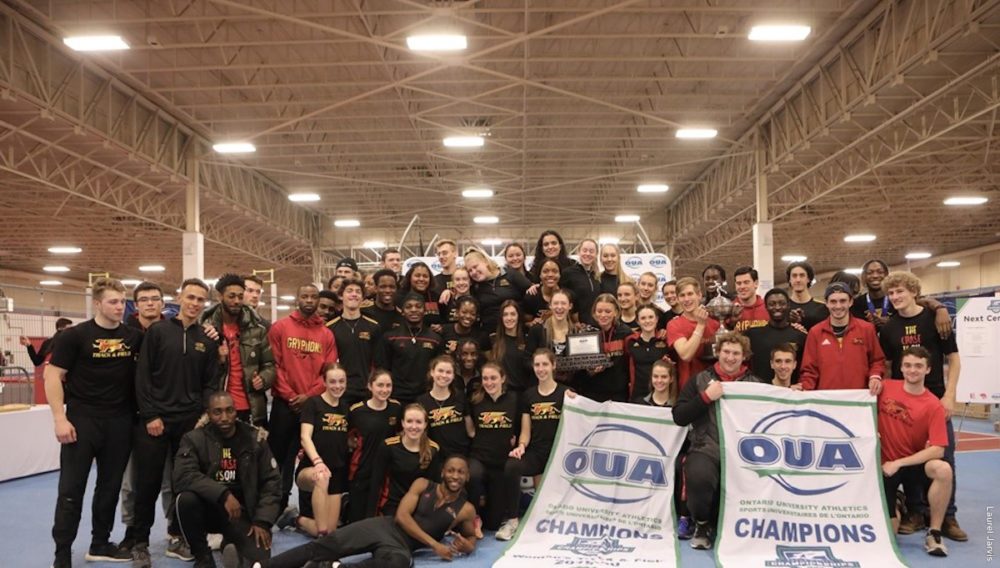 Crowd of victorious track and field athletes