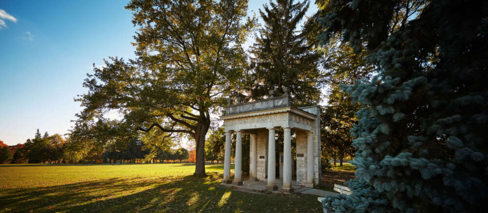 Portico on U of G Campus with sunbeams peeking through the columns