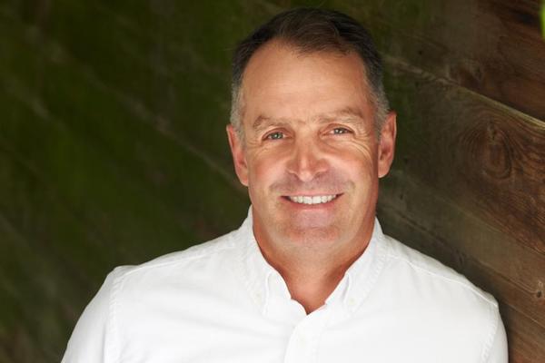 Smiling man in white shirt