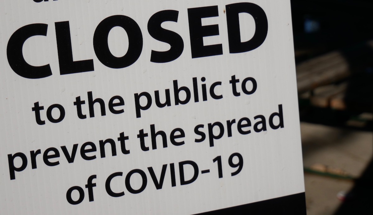 Sign says closed due to COVID-19