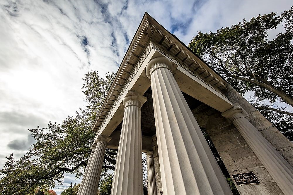 pillars of portico shot from below against the day sky