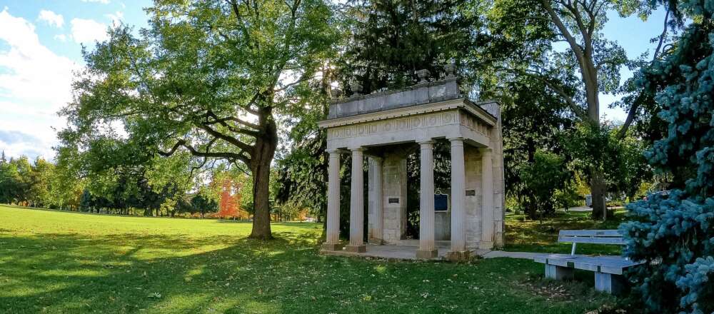 The portico surrounded by trees in the summer