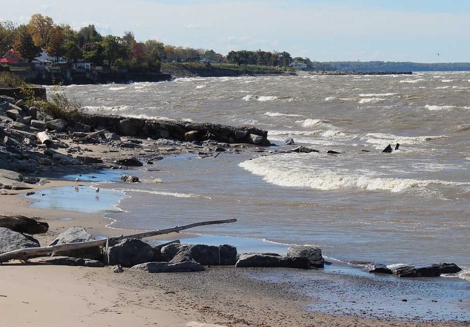A Lake Erie beach with cloudy water and white crests