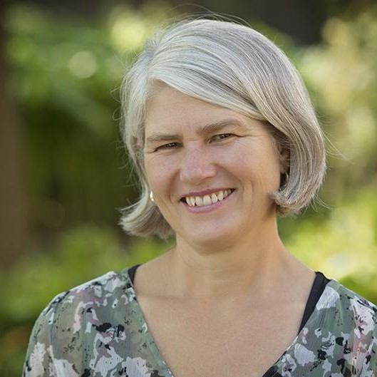 Dr. Claudia Wagner Riddle poses for a headshot outside.