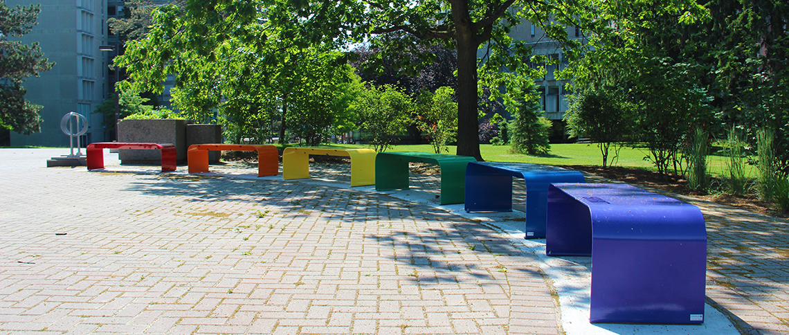 Series of benches in Pride colours on U of G campus