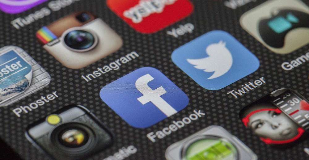 The icons of several social media are shown on a screen