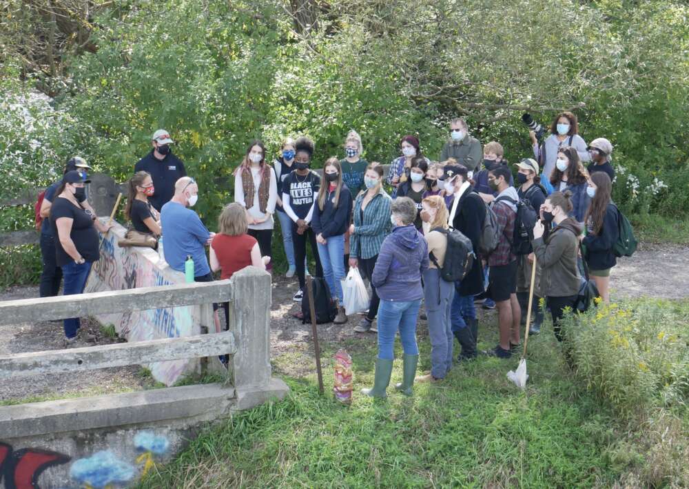 About 20 students in a group outdoors