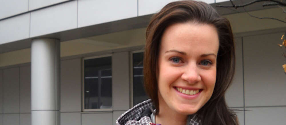 Young woman in outdoor campus setting
