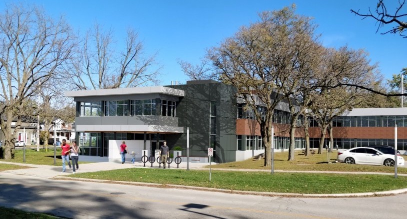 An artist rendering of a 3-floor modern building