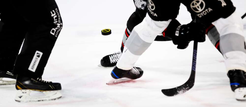 People playing ice hockey