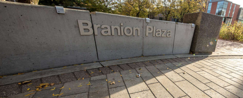 a low concrete wall with the words Branion Plaza
