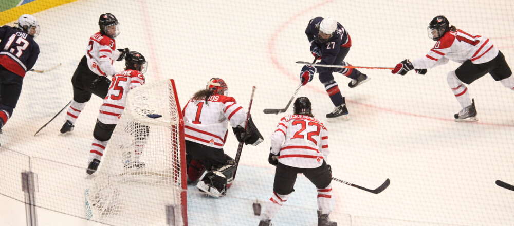 Canada's and USA's women's hockey teams play against each other at the 2010 Winter Olympics.