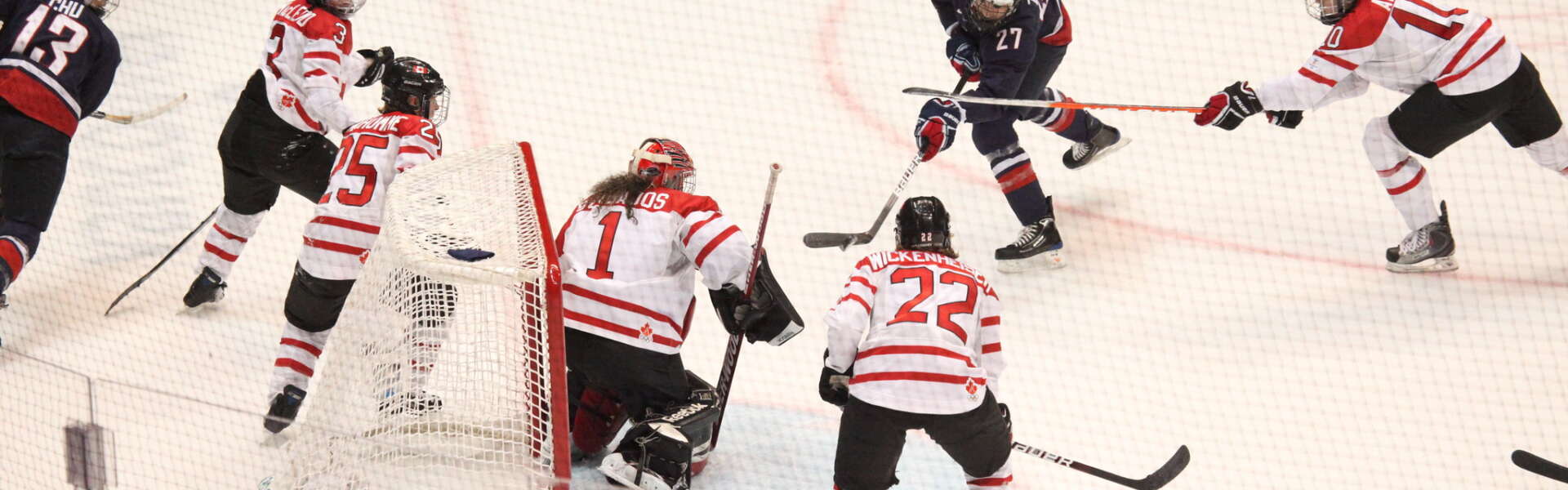 Canada's and USA's women's hockey teams play against each other at the 2010 Winter Olympics.