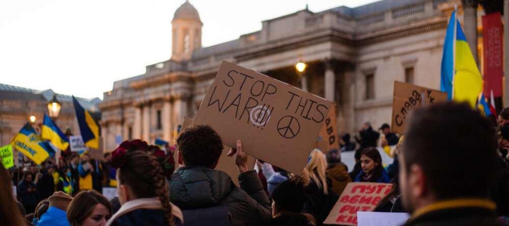 Protesters in London carry signs in support of Ukraine