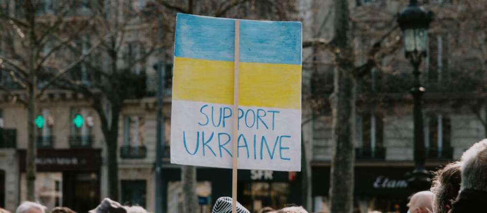 Large Group of People Holding Banner on Supporting Ukraine