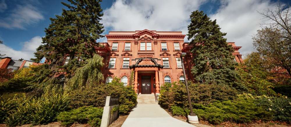 a wide view of the sandstone building of Macdonald Hall