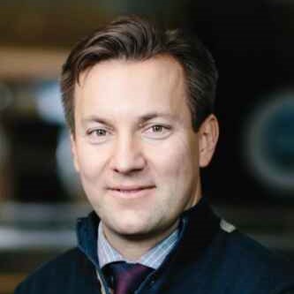 A headshot of Dr. Nikola Gradojevic