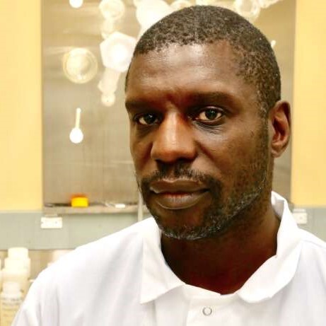 Dr. Lawrence Goodridge poses for a photo in a lab