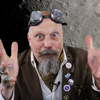 Orbax stands in front of the moon with his hands outstretched, as if he were holding a ball, and looks right into the camera.