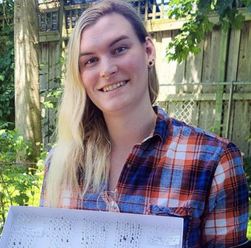 Aaron FAirweather sits outside for a portrait