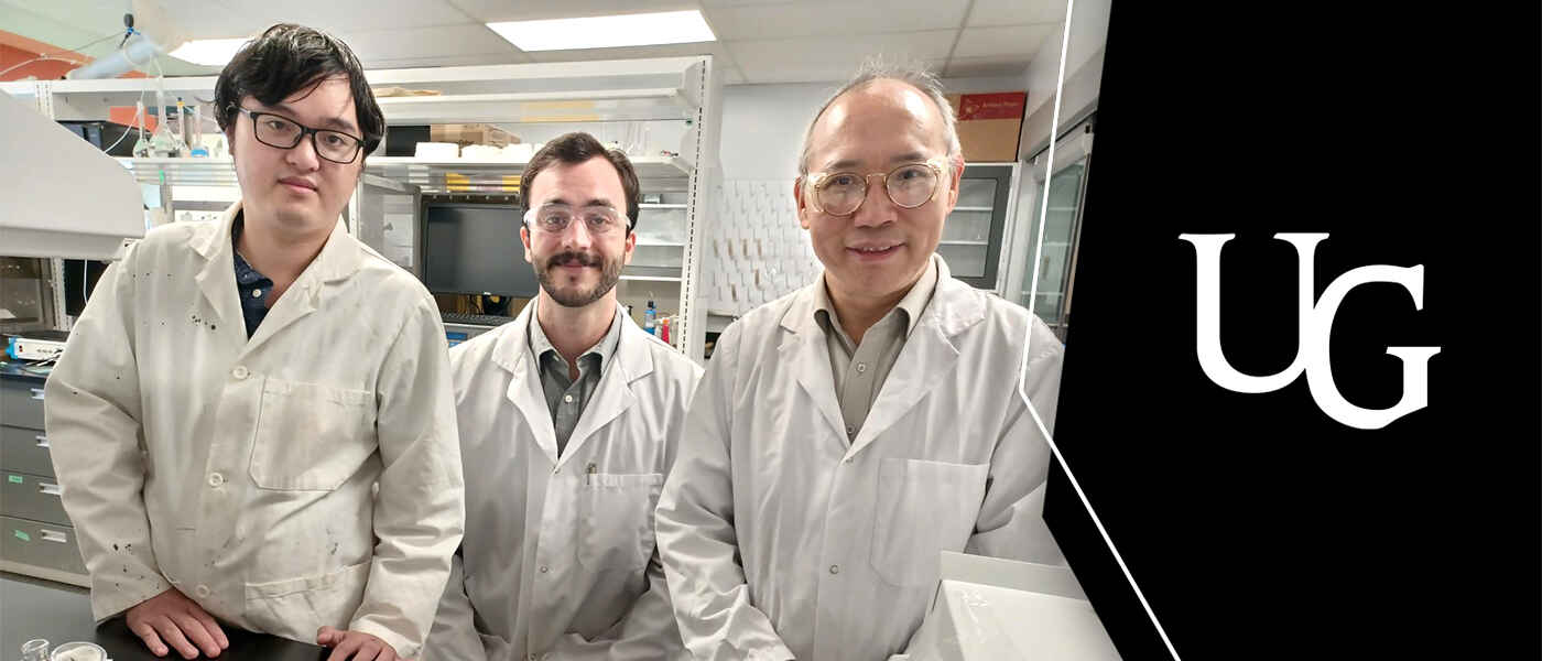 three men in chemistry lab wearing lab coats alongside the U of G cornerstone logo