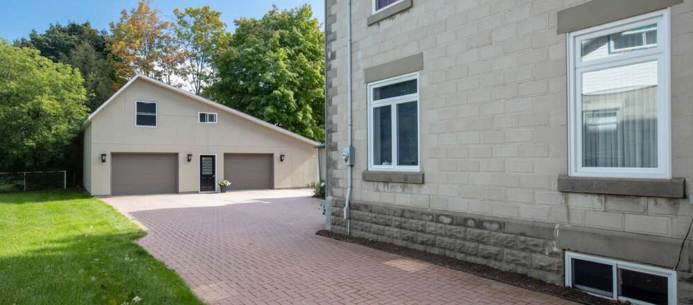 A beige house and garage.