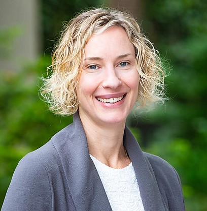 A head and shoulders shot of Dr. Noella Gray smiling for the camera