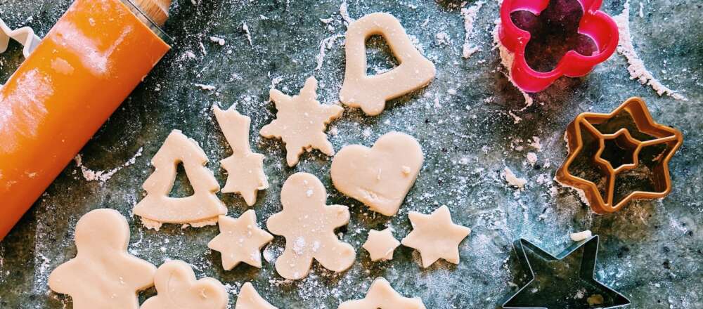 Macro photography of different cookies, cookie cutters and rolling pins