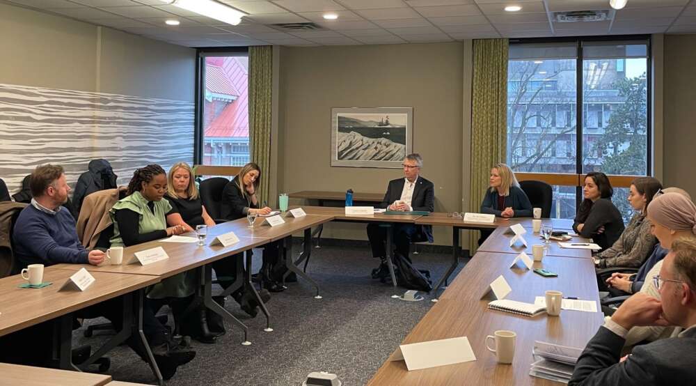 MP Lloyd Longfield, with Dr. Jess Haines to his left and Jessica Bowes, AVP, research (innovation & knowledge mobilization) on his right, with community advisers sit a U-shaped boardroom table