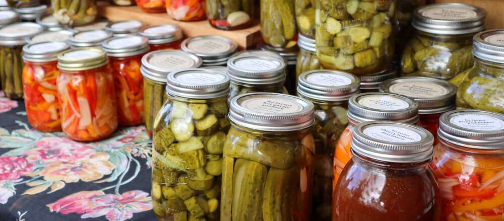 Clear glass jars with pickled goods inside
