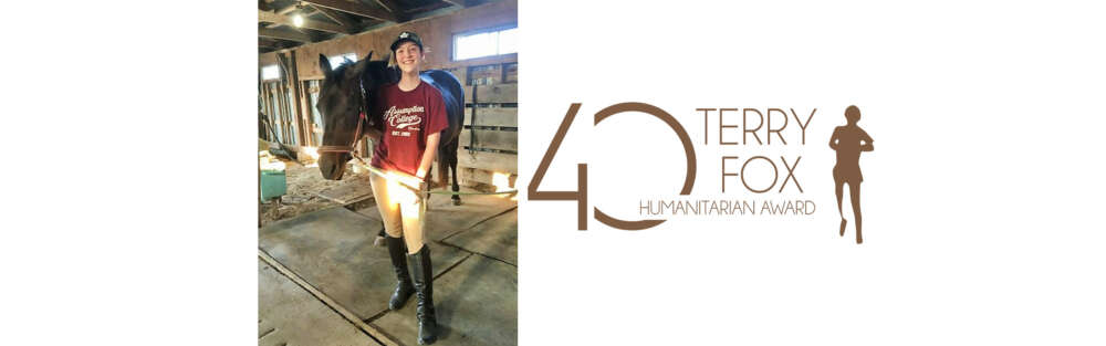 A person standing in a barn holding the reins of a horse next to the logo for the 40th anniversary Terry Fox Humanitarian Award