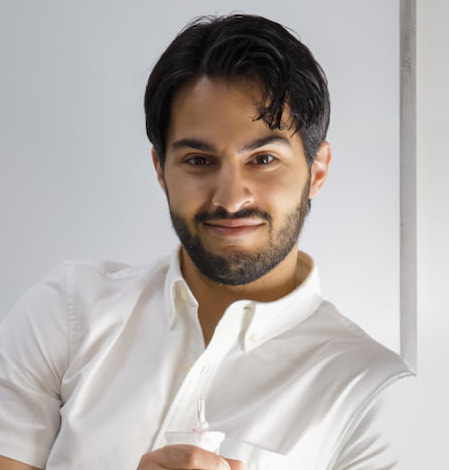 a person smiles for a portrait