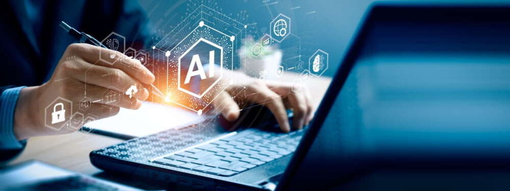 A graphic showing hands typiing on a laptop with symbols overlaid in white of AI