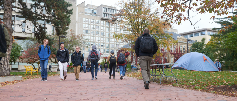 Students walk through Branion Plaza in the fall.