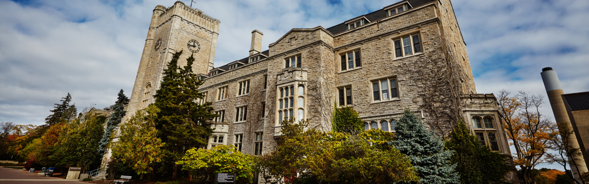 Johnston Hall against a partly cloudy sky.