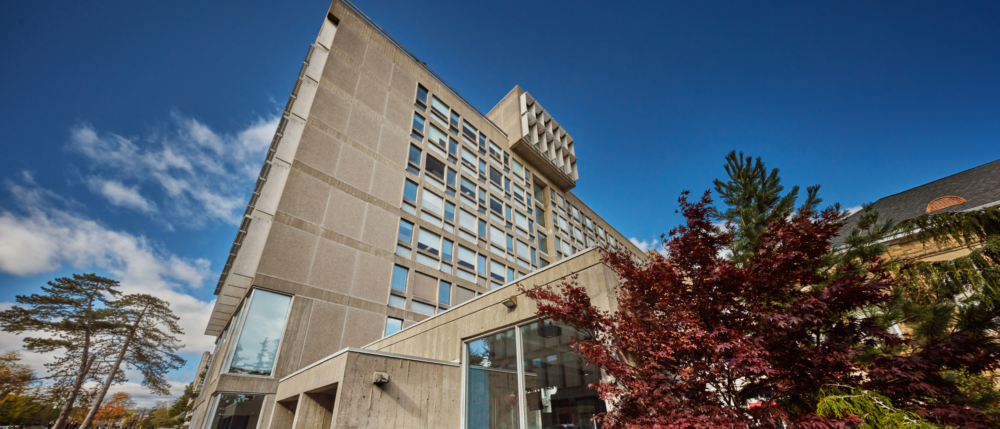 The MacKinnon building against a blue sky.