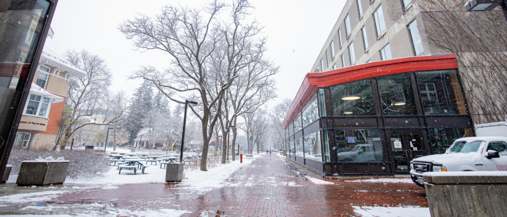 The path in front of the university centre on a snowy day.