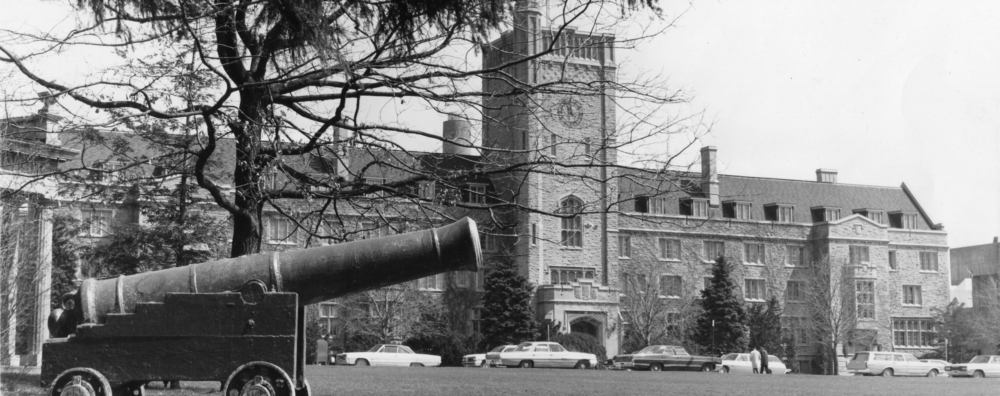 An old black and white photo of the U of G cannon in front of Johnston Hall.